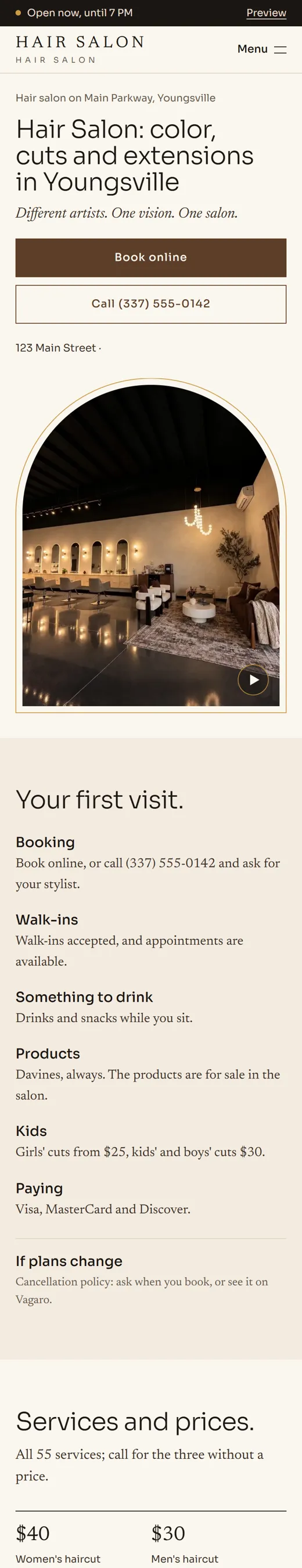 Phone view of a concept site for a hair salon: the salon interior in an arch, book online and call buttons.